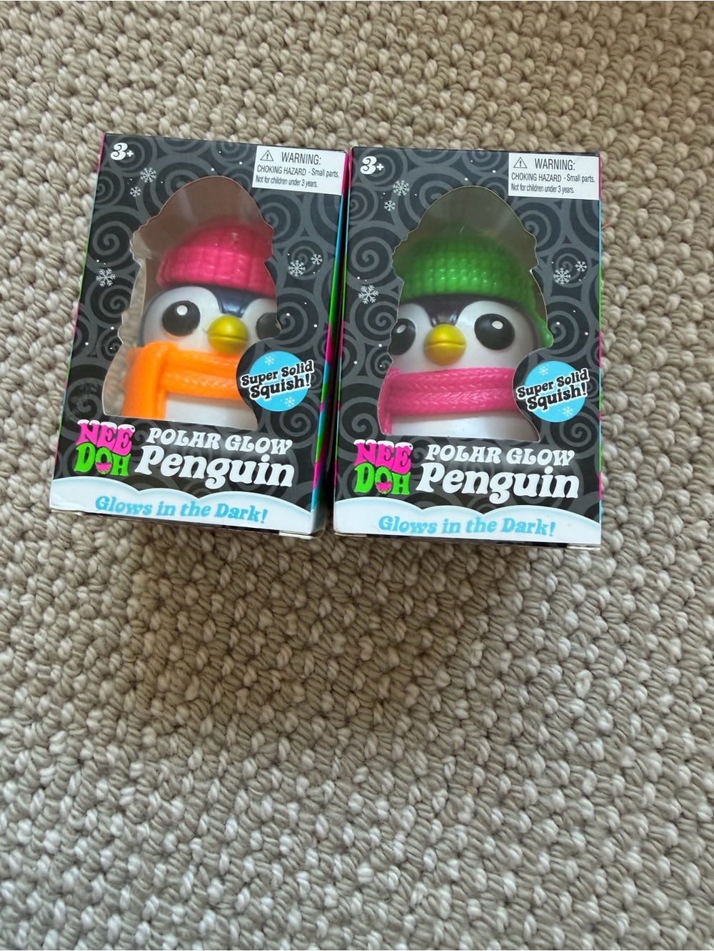2 new/authentic NeeDoh Polar Glow Penguin Squishy Toy - Pink & Green Hats